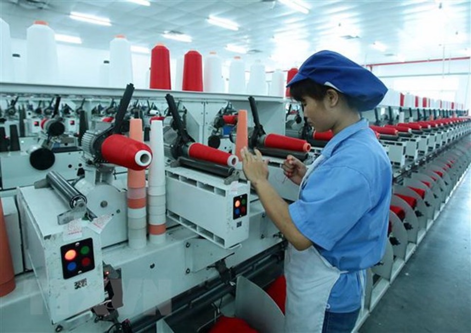 Dây chuyền sản xuất sợi tại Công ty TNHH Dệt nhuộm Jasan Việt Nam có vốn đầu tư của Trung Quốc tại Khu Công nghiệp Phố nối B, Hưng Yên. (Ảnh: Phạm Kiên/TTXVN)