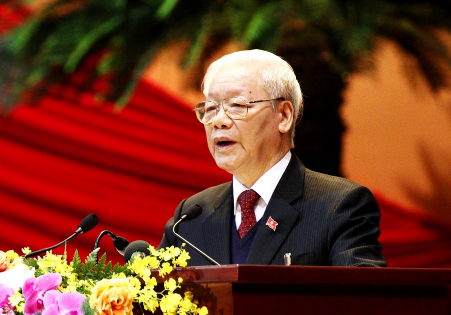 Tổng Bí thư, Chủ tịch nước Nguyễn Phú Trọng trình bày Báo cáo của Ban Chấp hành Trung ương Đảng khóa XII về các văn kiện trình Đại hội XIII của Đảng