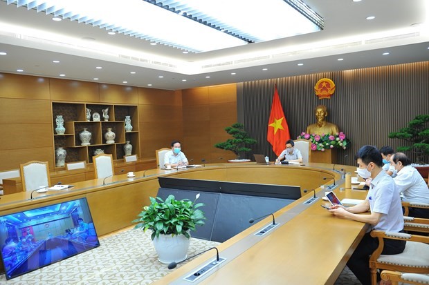 Phó Thủ tướng Chính phủ Vũ Đức Đam, Trưởng Ban Chỉ đạo Quốc gia phòng, chống dịch COVID-19 chủ trì cuộc họp trực tuyến với tỉnh Bắc Giang. (Ảnh: Minh Đức/TTXVN)