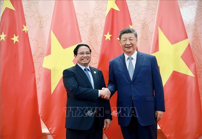 Thủ tướng Phạm Minh Chính hội kiến Tổng Bí thư, Chủ tịch nước Trung Quốc Tập Cận Bình. (Ảnh: TTXVN)

