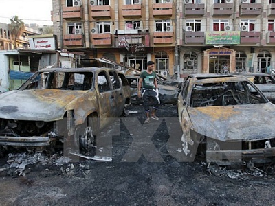Hiện trường vụ đánh bom ở trung tâm thủ đô Baghdad của Iraq. (Ảnh: Reuters/TTXVN)