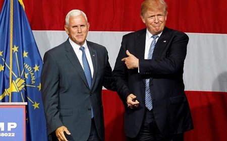 Ứng cử viên Tổng thống Mỹ Donald Trump (phải) và người đồng tranh cử Mike Pence - Ảnh: Reuters.