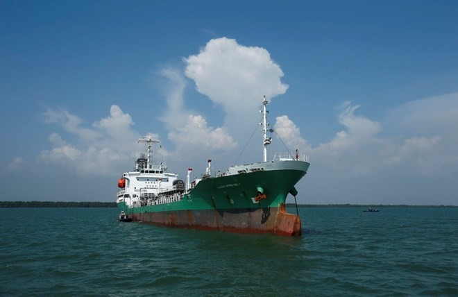 Đại biểu Quốc hội biểu quyết thông qua Luật. (Ảnh: Phương Hoa/TTXVN)