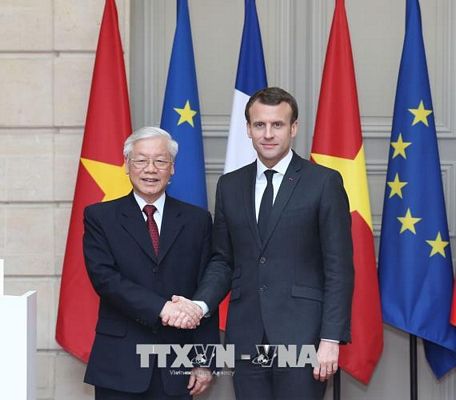 Tổng Bí thư Nguyễn Phú Trọng và Tổng thống Cộng hòa Pháp Emmanuel Macron. Ảnh: Trí Dũng/TTXVN