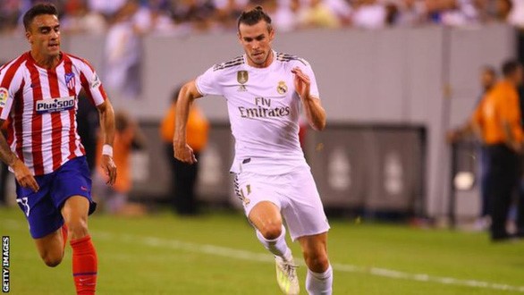 Gareth Bale (phải) đã từ chối thi đấu cho Real Madrid sau khi bị ngăn cản sang Trung Quốc - Ảnh: Getty Images