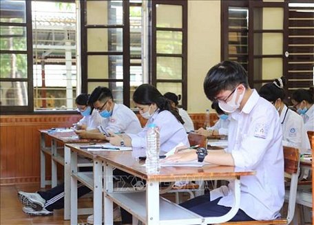 Thí sinh thực hiện nghiêm túc quy chế thi và quy định về phòng, chống COVID-19. Ảnh minh họa: An Đăng/TTXVN