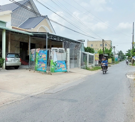 Nhà phố khang trang hơn, đời sống người dân Tân Hội ngày càng nâng chất.